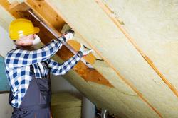 worker installing insulation