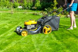 person mowing lawn