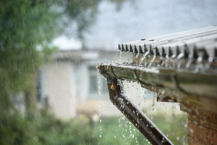 rain rolling off a roof during a storm