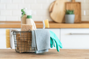 A basket of kitchen cleaning supplies