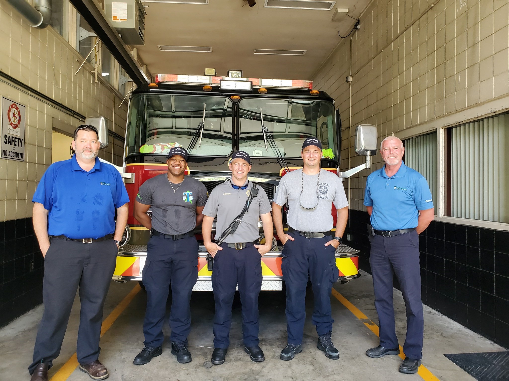 McCall Pest & Wildlife team members with members of the Tallahassee Fire Department