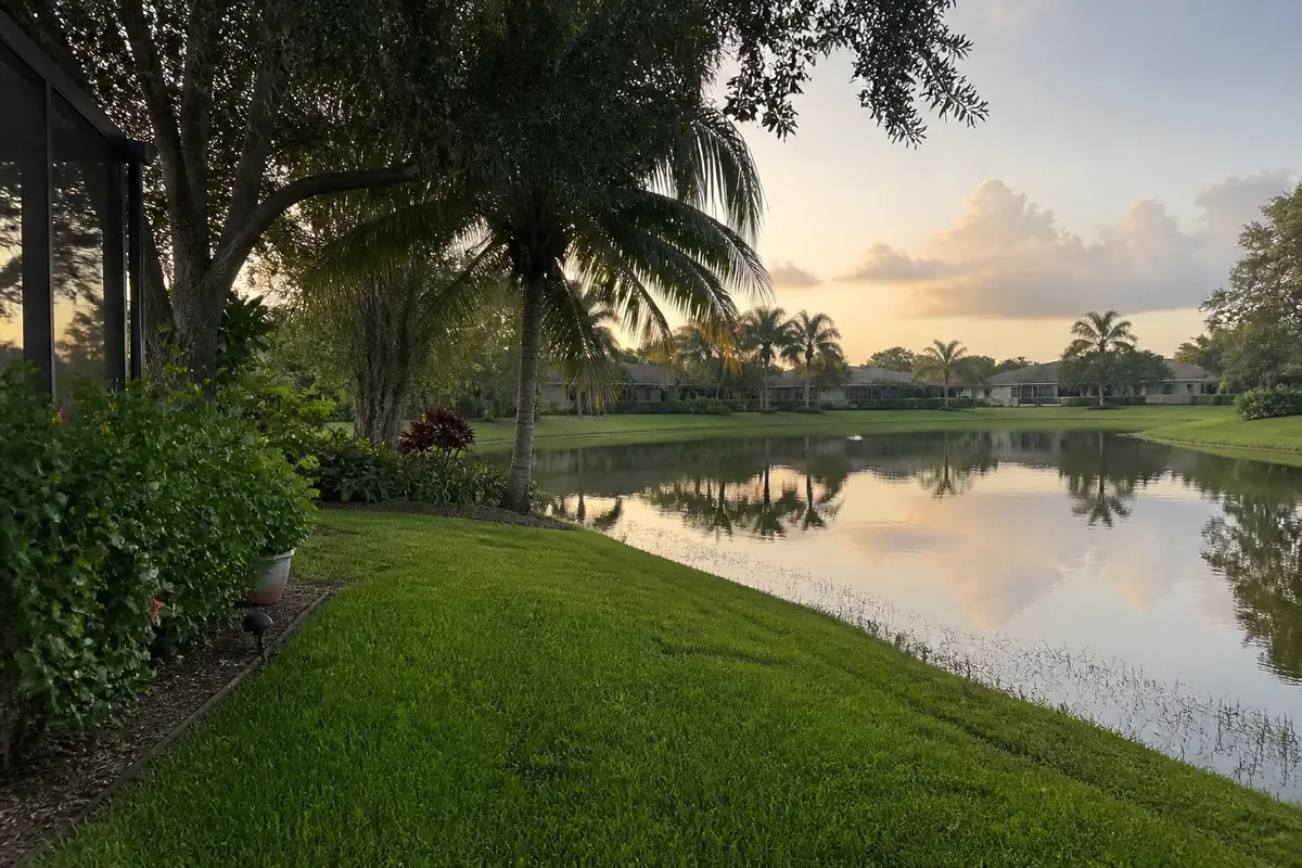 A Central Florida backyard bordering a neighborhood lake and retention pond near Orlando, the kind of property that draws heavy mosquito pressure.